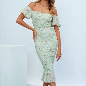 Beautiful floral smocked dress. New with tags. Not maternity but bump friendly.